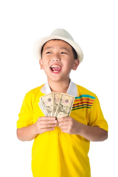 Asian child holding money while standing isolated on white backg — Stock Photo, Image