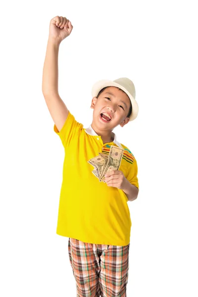 Asian child holding money while standing isolated on white backg — Stock Photo, Image