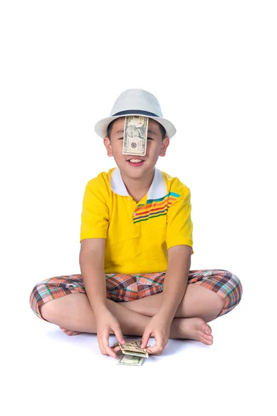 Asian child holding money while standing isolated on white backg — Stock Photo, Image