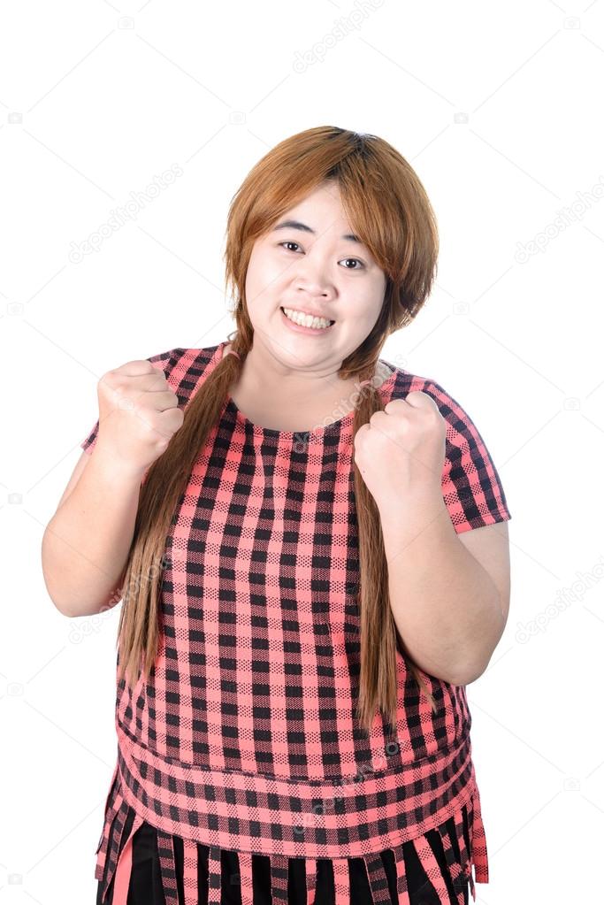 Successful plump woman punching the air with her fists in air, s