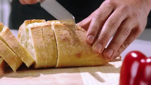 Chef Cuts Bread Slow Motion Slicing Bread Wooden Cutting Board — Stock Video