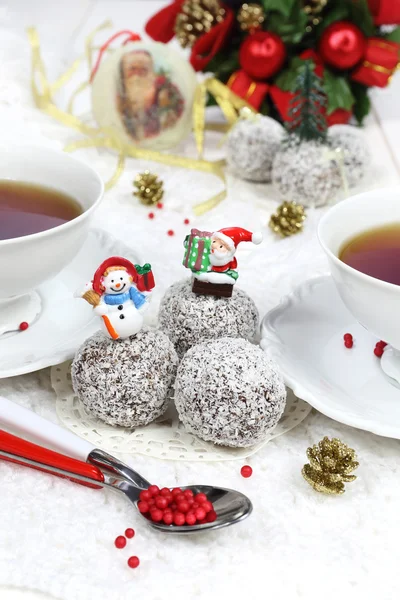 Happy new year: chocolates in coconut flakes in the New Year dec — Stock Photo, Image