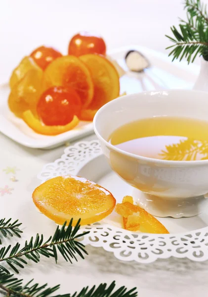 New Year spirit: candied fruits and fir branches — Stock Photo, Image