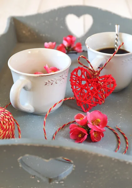Valentine's Day: coffee, blossoming branch and hearts — Stock Photo, Image
