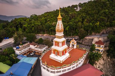 Beautiful sunset at Wat Doi Thep Nimit Monastery on the top of Patong hill in Phuket, Thailand.