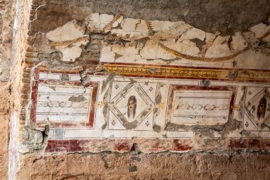 Ruins of ancient Greek city Ephesus. Antique mosaic on the floor of destroyed buildings. Details of geometric mosaic. Famous open air museum. Izmir, Turkey - October 07 2020.