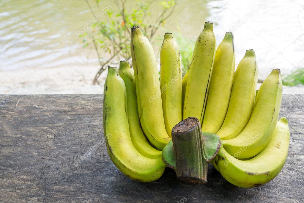 Fresh bananas on wooden table