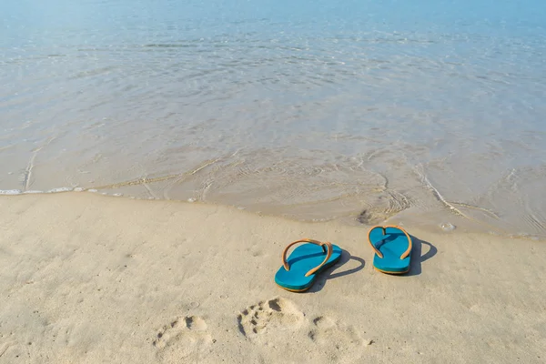 Green slippers with the sand beach in Phuket Thailand — Stock Photo, Image