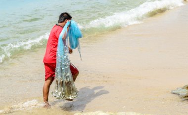 Fishermen casting nets clipart