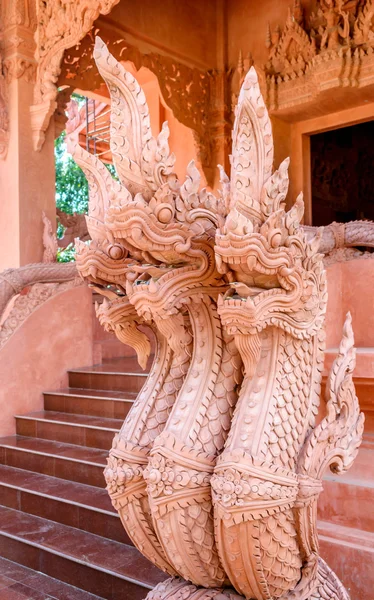 Statue of a mythical serpent at a Buddhist temple — Stok fotoğraf