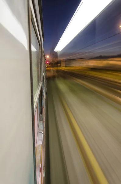Train at full speed crossing the station — Stock Photo, Image