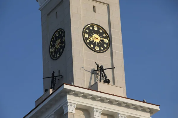 Clock tower.Two clocks are located on different sides.Close-up of the wall clock is beautifully decorated.The building of river station Moscow Russia