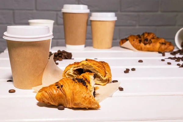 Take Away Coffee with Fresh Croissant With Chocolate and Coffee Beans on wooden background, Copy Space — Stock Photo, Image