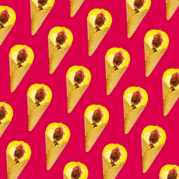 Pattern of Half a ripe peach in sweet wafer cone in pink background, Creative Food Concept, Flatlay.