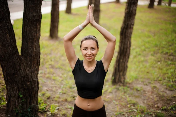 Practicing of yoga outdoors in forest — Stock Photo, Image