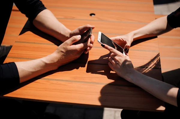 Close-up Of Two People Hands with Mobile Phones — Stock Photo, Image