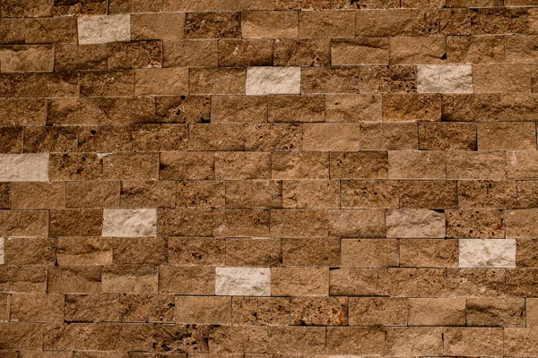 石墙作为背景或纹理.漂亮的褐色壳砖砌筑. — 图库照片