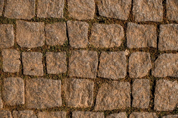 Granite cobblestone pavement background. Natural stone textured background. Paving texture — Stock Photo, Image