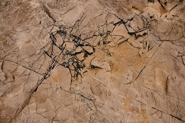Textura de pedra marrom velha com rachaduras na superfície. — Fotografia de Stock