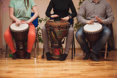 Group of Jambe drummers playing  clipart