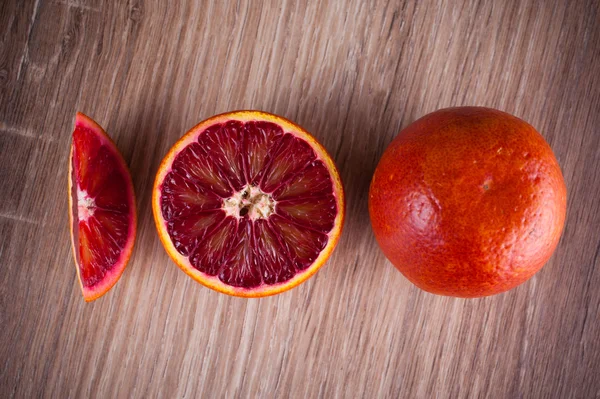 Red blood sicilian orange whole, half and wedge — Stock Photo, Image