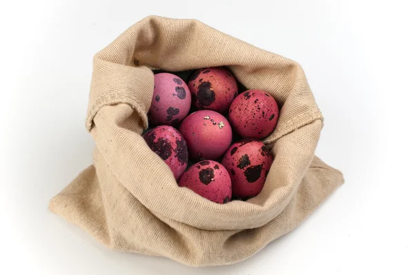 Pink quail easter eggs  in bag on white background — Stock Photo, Image