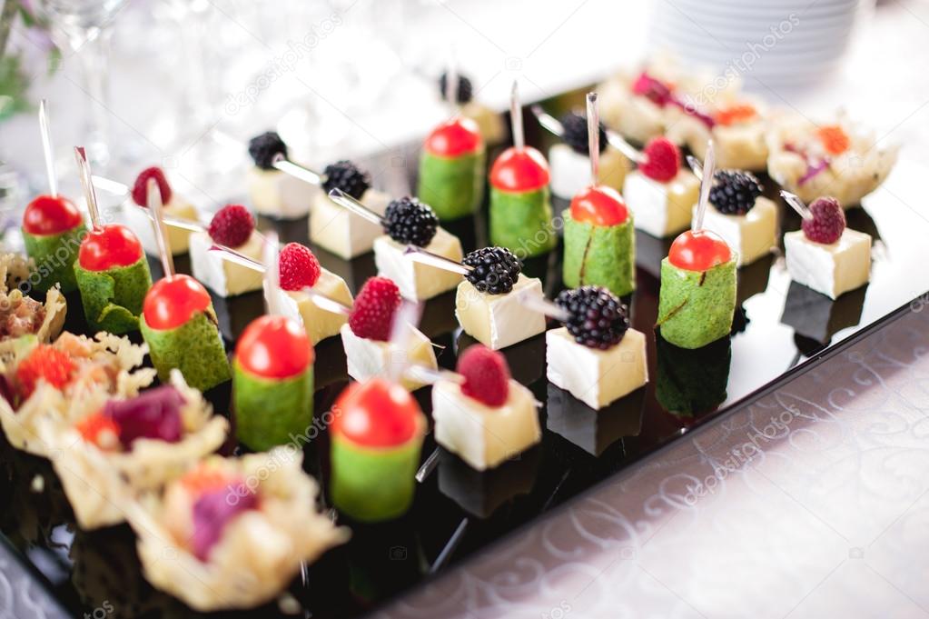 mixed fingerfood canapes on appetizer table