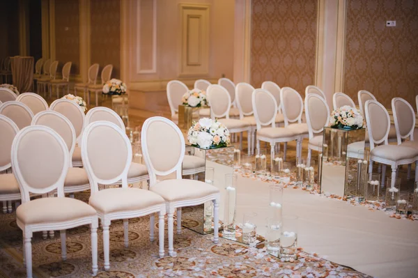 Beautiful wedding ceremony design decoration elements with arch, floral design, flowers, chairs