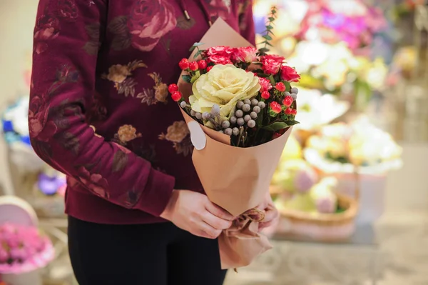 Florist holding bouquet colorful flowers shop assistant hands