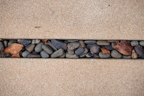 Black stone texture between path tiles — Stock Photo, Image