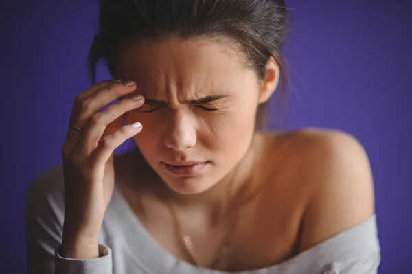 Close up Portrait of woman with headache — Stock Photo, Image