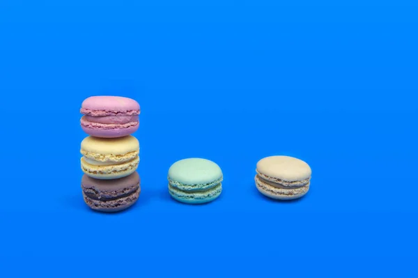 Image Few Macarons Various Colors Stacked Table Blue Background Copy — Stock Photo, Image