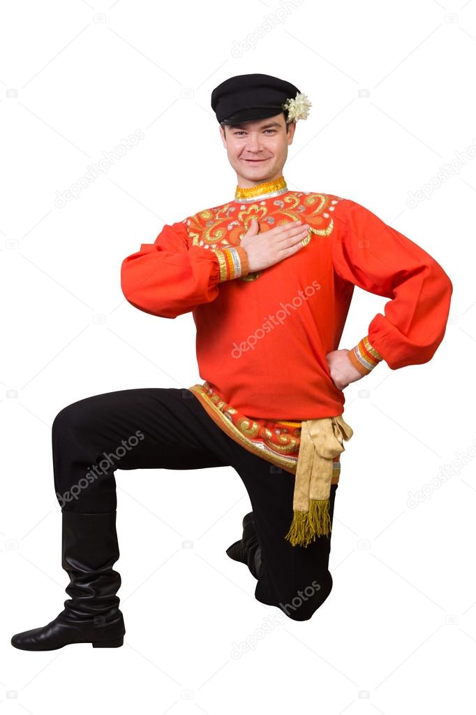 attractive caucasian guy dancing in folk costume