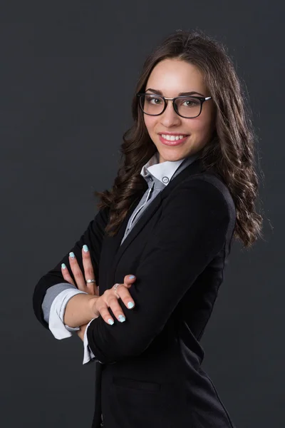 Retrato de una mujer de negocios sonriente en gafas — Foto de Stock