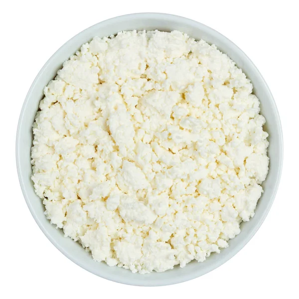 Beyaz arka planda izole edilmiş beyaz bir fincanda yağsız peynir. Üst görünüm.