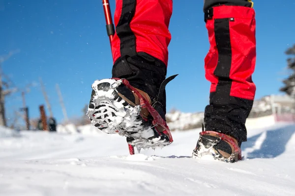View of walking on snow with Snow shoes and Shoe spikes in winte — Stock Photo, Image