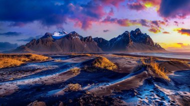 Panoramic landscape at sunrise. Vestrahorn mountains in Stokksnes, Iceland. clipart