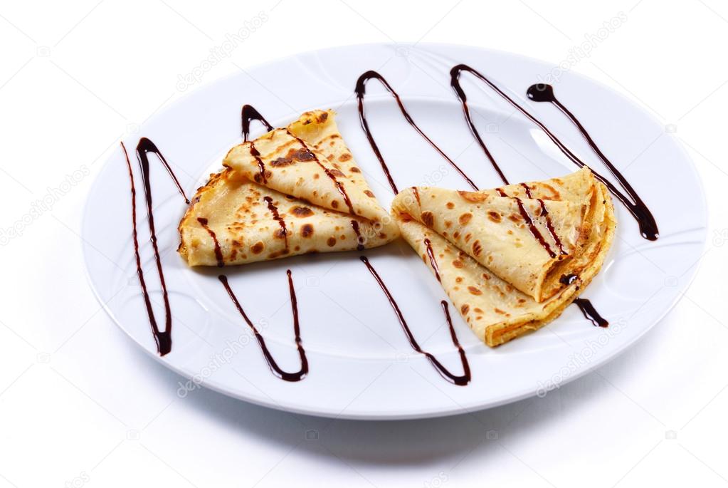 Delicious pancakes with chocolate sauce