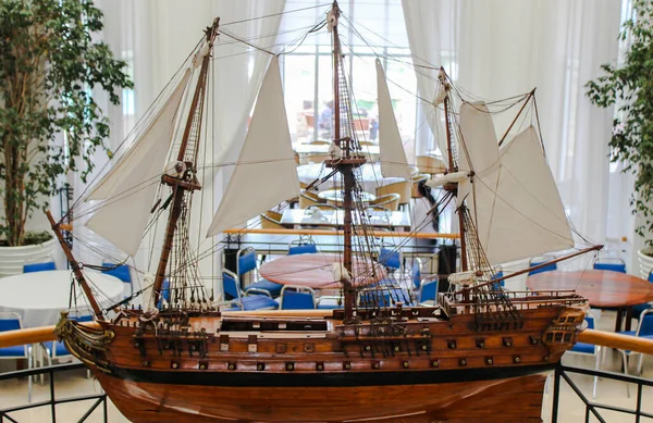 Model of a sailing ship in a museum of contemporary art