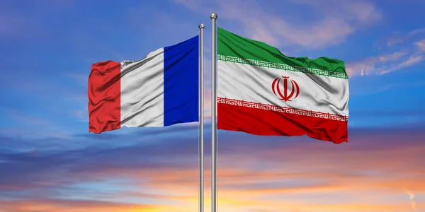 iran flag with France flag.Beautiful national state flags of Iran and France together at the sky