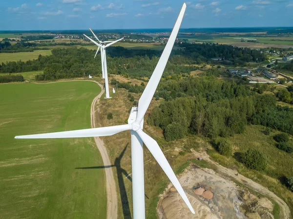 Drone view of a wind turbine on a Sunny day. Environmental friendliness, the concept of renewable energy sources.