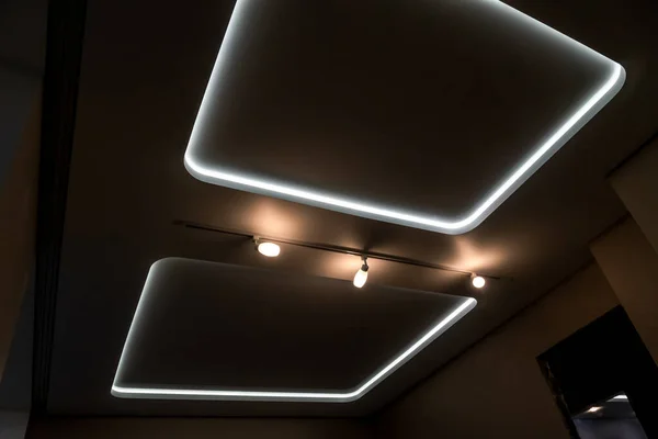Beautiful stretch ceiling with led lighting. Two squares and lights