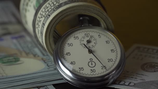 Dollars and stopwatch. Business concept of lost time and failed investments — Stock Video