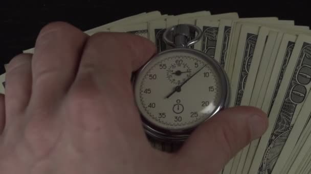 Dollars and stopwatch. Business concept of lost time and failed investments — Stock Video