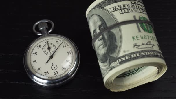 Dollars and stopwatch. Business concept of lost time and failed investments — Stock Video