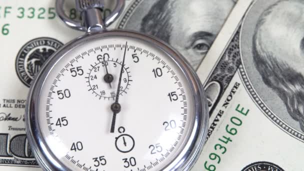 Dollars and stopwatch. Business concept of lost time and failed investments — Stock Video