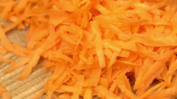 Grated carrot extreme close up rotating very slowly stock footage — Stock Video