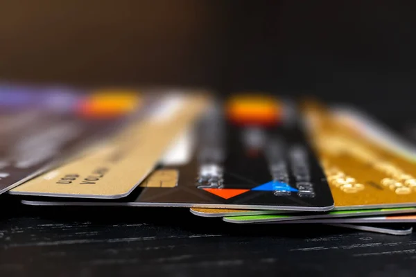 Credit cards close-up. They lie on top of each other, creating lots and lots of them