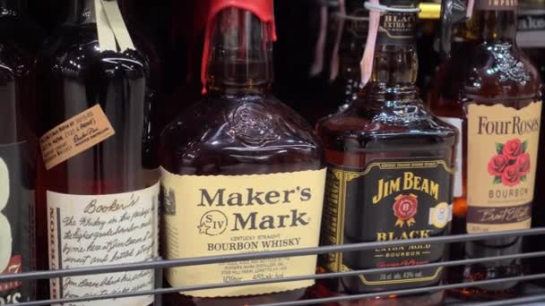 MOGILEV, Belarus - March 21, 2021: Luxury whiskey goods on shelves in store — Stock Video