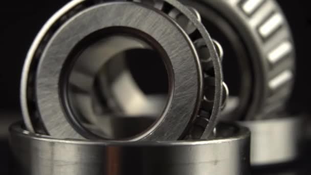 Cyclic seamless video with bearings rotating on turntable on a black background. — Stock Video